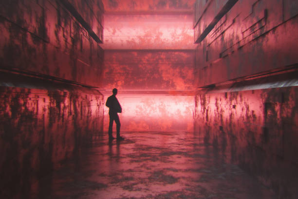 istock Man standing in futuristic urban corridor 1672367027