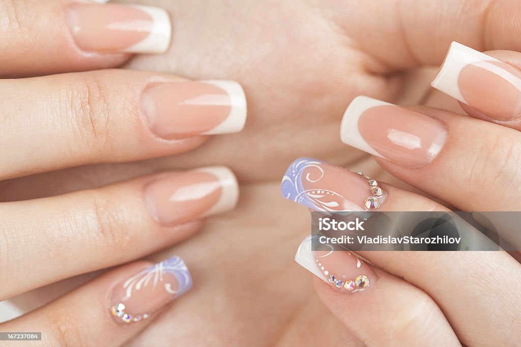 Beautiful female hands with french manicure Beautiful female hands with french manicure closeup Beautician Stock Photo