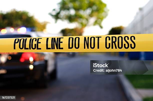 A Police Crime Scene Tape Closeup Stock Photo - Download Image Now - Barricade Tape, Crime Scene, Police Force