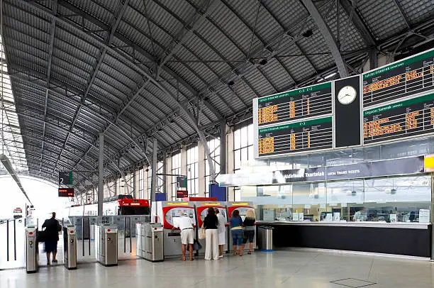 Railway station platforms and ticket office with people