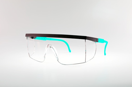 Pair of safety goggles on a background