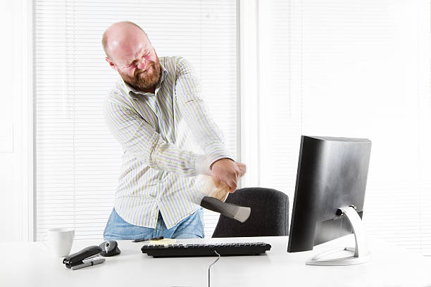 istock Angry Office worker Attach Monitor with Axe 167238287