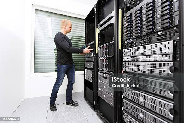 Install Network Router In Datacenter Stock Photo - Download Image Now - 25-29 Years, Adult, Backup