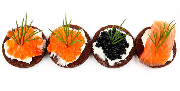 istock Black bread topped with salmon, trout and sturgeon caviar 167239646