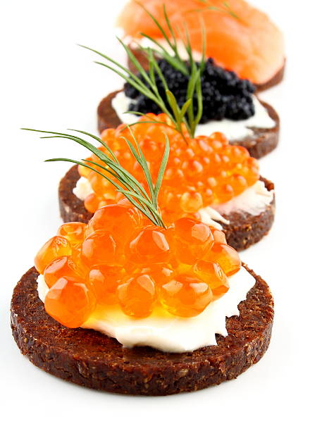 istock Black bread topped with salmon, trout, sturgeon caviar and fish 167239670