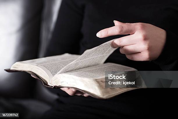 Woman Sits In A Sofa And Read The Bible Stock Photo - Download Image Now - Bible, Studying, Teenager