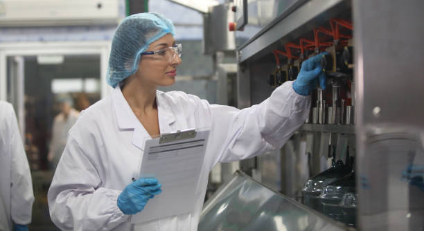 istock woman worker in water drink factory 1672397507