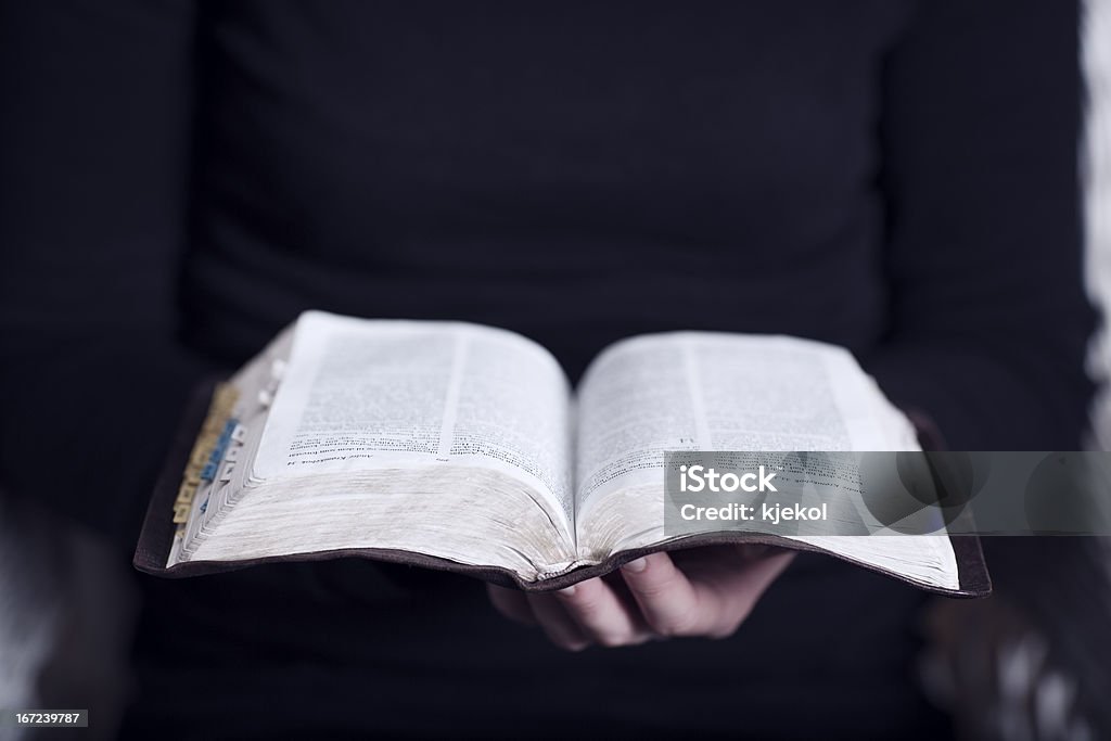 Reading the Bible A close-up of a christian woman reading the bible.  Adult Stock Photo