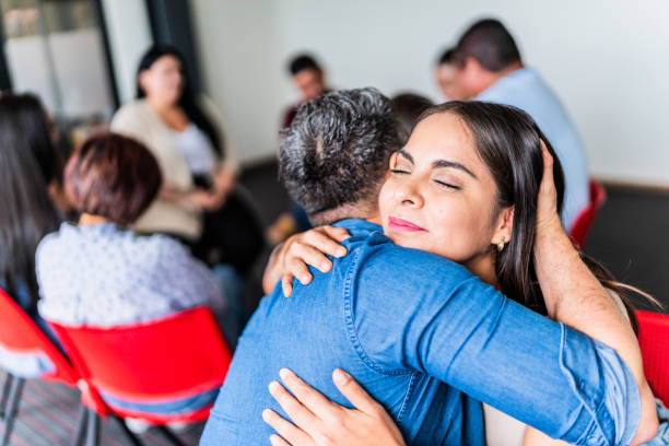 istock Patients embracing during a group therapy at mental health center 1672415840