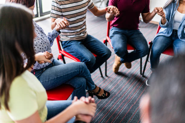 istock Religious group praying for each other in a meeting 1672416263