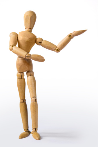 Wooden dummy showing something with a hand