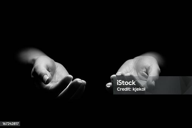 Hands Reaching Out Stock Photo - Download Image Now - Black And White, Black Background, Women