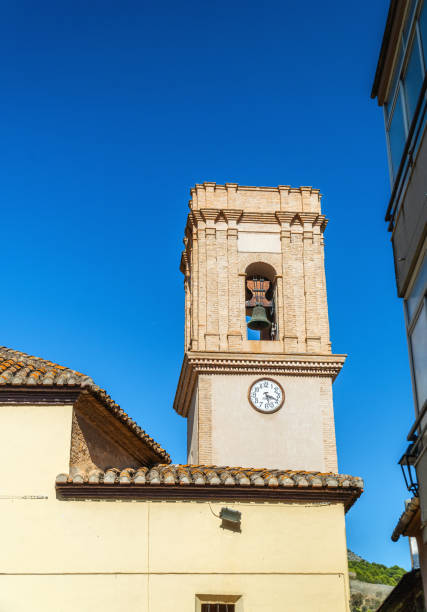 istock old spanish Bell tower against blue sky 1672433801