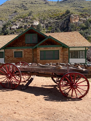 Wooden wagon in front of brick building