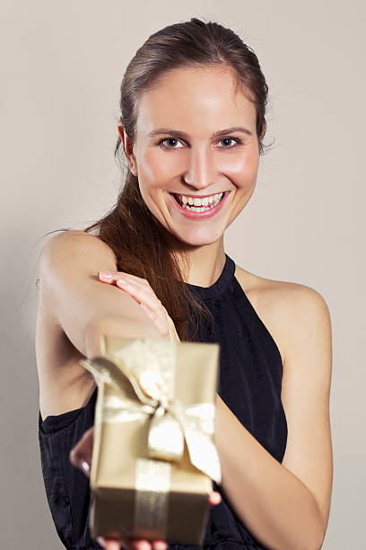 istock Smiling Girl Holding a Gift 167244245