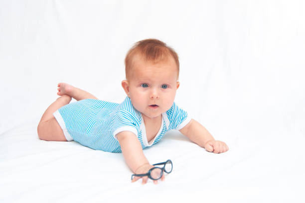 istock Cute baby in a striped suit 1672446834