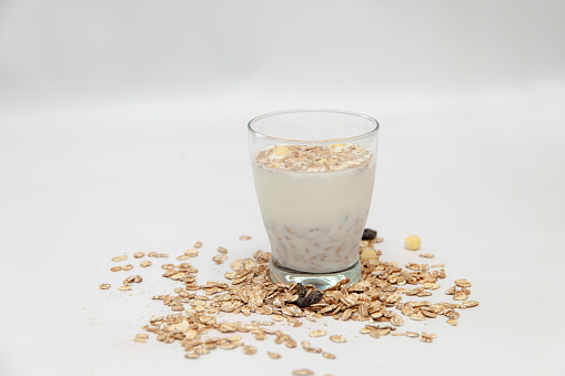 Idea or great breakfast - glass with milk and muesli.