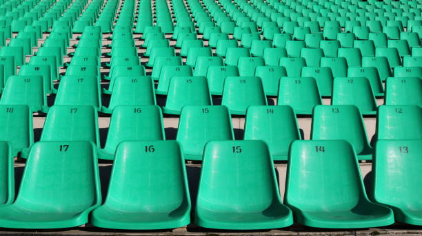empty numbered seats at a sports stadium