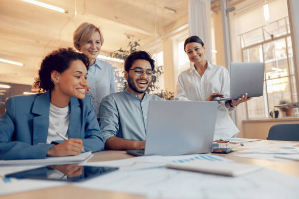 istock Coworkers discussing biz related problem in the office and using laptop. Conception of business team 1672478515