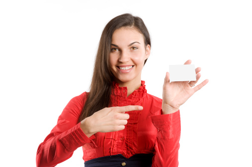 very cute happy woman in red shirt with business card over white