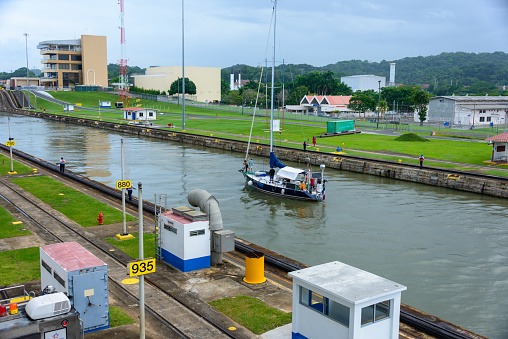 French sailboat transiting the Panama canal at the Miraflores locks