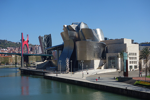 Bilbao, Spain - April 2, 2021: Exterior views of the Guggenheim Museum and Nervion river