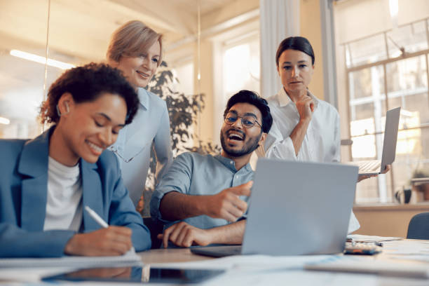 istock Coworkers discussing biz related problem in the office and using laptop. Conception of business team 1672504012