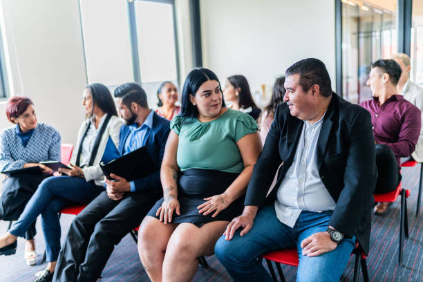 istock Coworkers talking during a seminar at office 1672508915