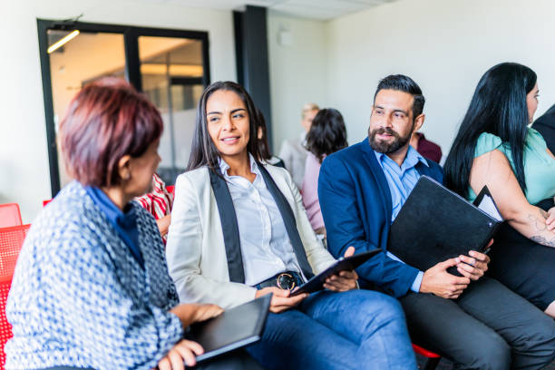 istock Coworkers talking during a seminar at office 1672512726