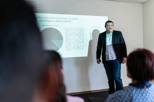 istock Mature businessman doing a presentation at meeting office 1672518768