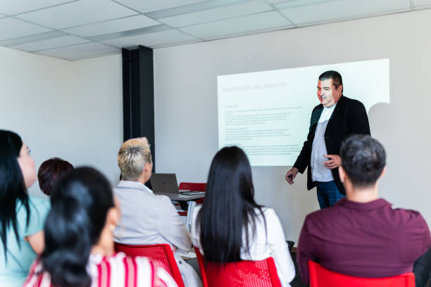 istock Mature businessman doing a presentation at meeting office 1672518777