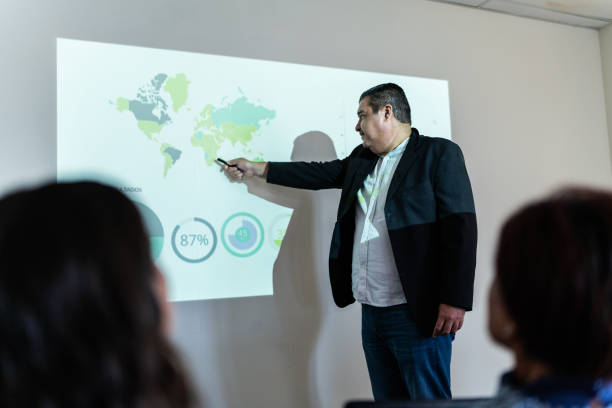 istock Mature businessman doing a presentation at meeting office 1672519313
