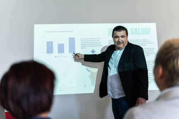 istock Mature businessman doing a presentation at meeting office 1672519320