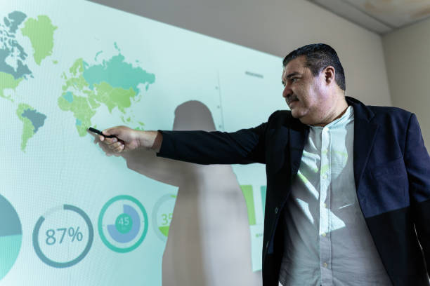 istock Mature businessman doing a presentation at meeting office 1672519502