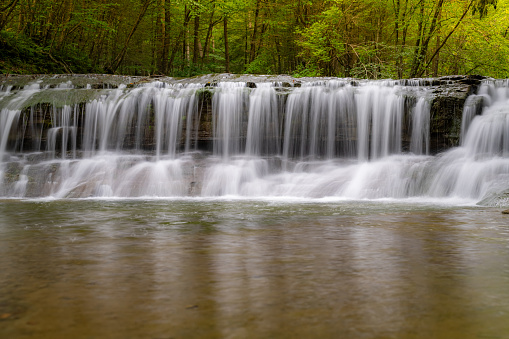 Late afternoon Summer photo of a waterfall in Robert H. Treman State Park near Ithaca NY, Tompkins County New York.