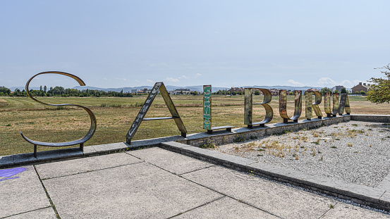 Vitoria-Gasteiz, Spain - 21 Aug 2021: Salburua sign at the entrance of the Salburua Wetlands, in Vitoria-Gasteiz, Basque Country, Spain