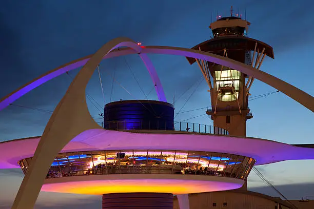 Theme Building and tower of Los Angeles International Airport at dusk