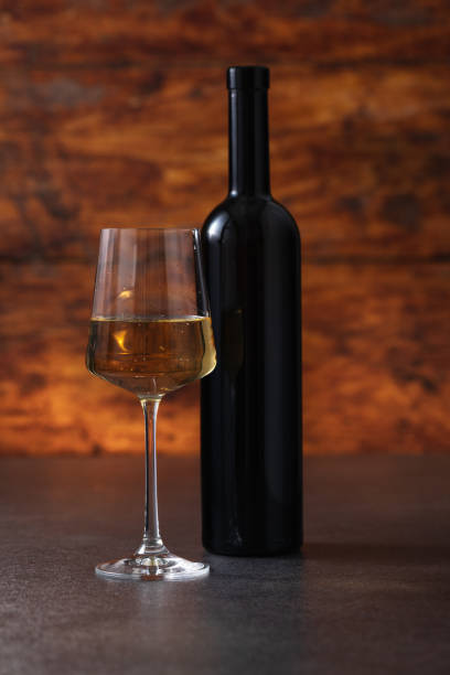 istock Excellent white wine on a wooden background 1672568070