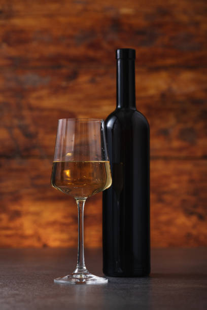 istock Excellent white wine on a wooden background 1672568595