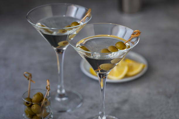 istock Two glasses of martini with olives 1672573569