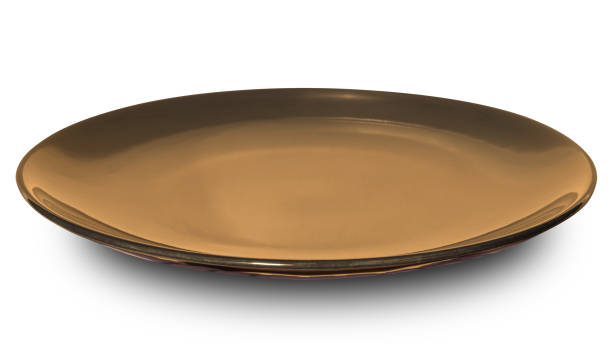 istock Brown circle ceramics plate isolated on white background. 1672684733