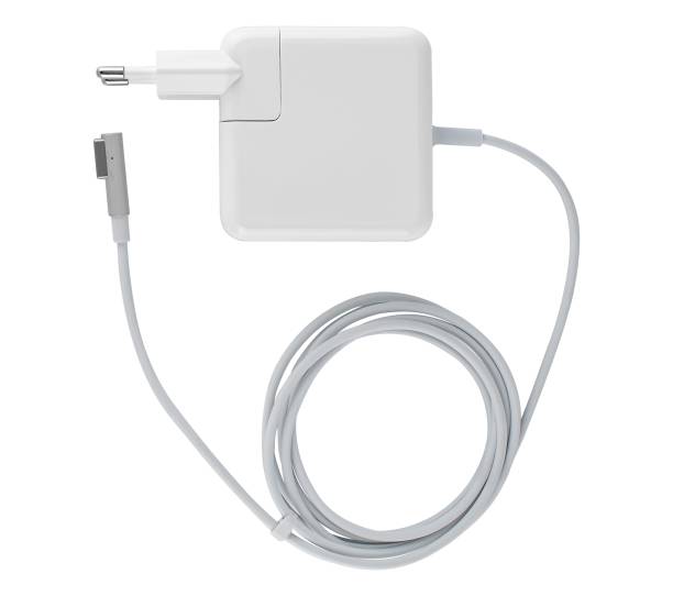istock laptop power adapter, on white background in insulation 1672722419