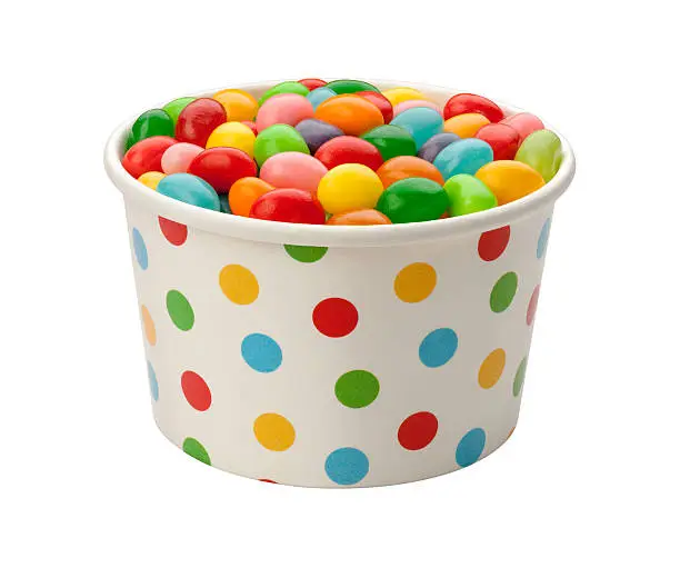 Jellybeans in a paper cup, isolated on white  with a clipping path.
