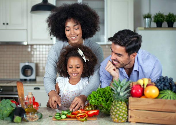 istock Happy young multiethnicity family in the kitchen. 1672796120