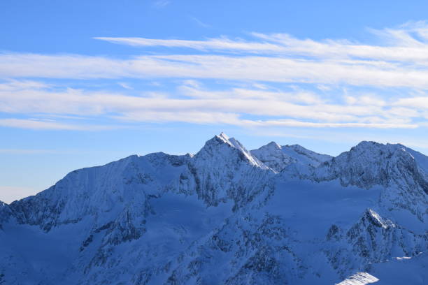 Stunning view from the Top Mountain Star restaurant at the peak of Hochgurgl Ski Resort, Austria. Beautiful snow capped mountain peaks of the Ötztal Alps and Italian Dolomites