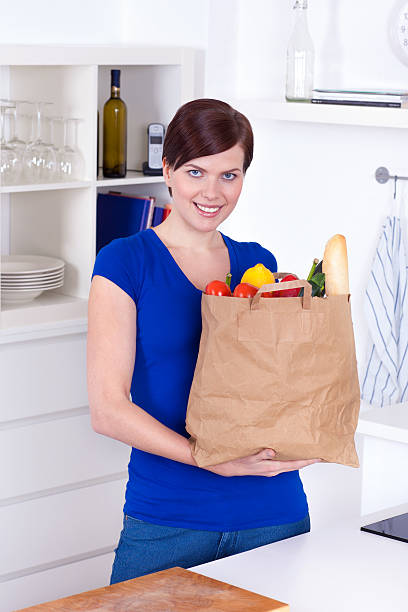 istock Woman with shopping bag in the kitchen 167283412
