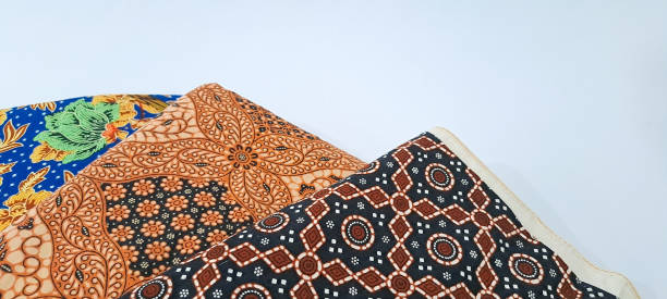 istock folding jarik or traditional Indonesian batik cloth isolated on white background. Javanese tradisional cloth 1672847428