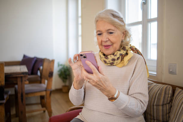 istock Happy senior woman using phone 1672863368