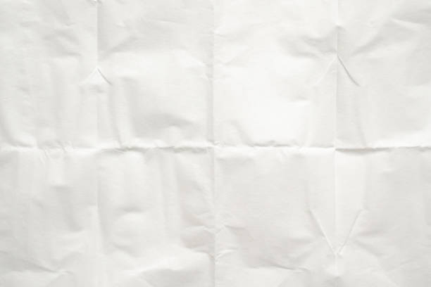istock White folded and wrinkled paper texture background 1672863905