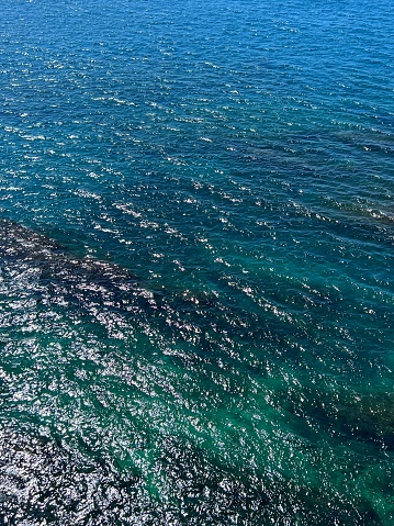 Shiny sea waves blue turquoise surface.